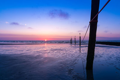 Scenic view of sea against sky at sunset