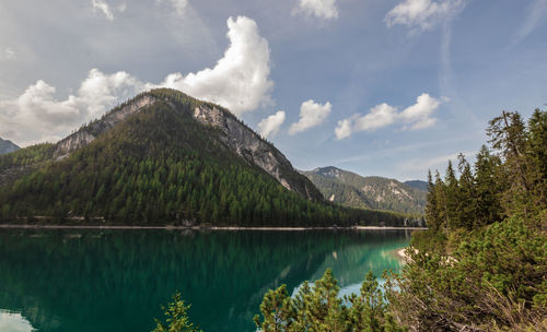 Scenic view of lake and mountains against sky