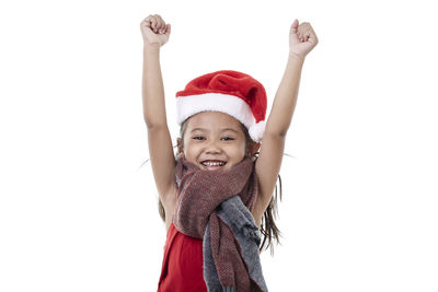 Portrait of smiling girl against white background