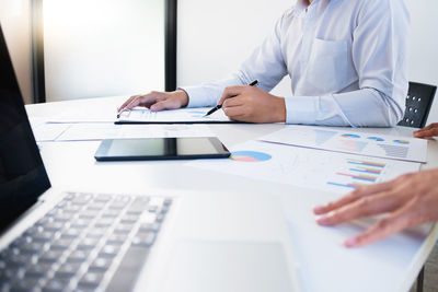 Man using laptop on table
