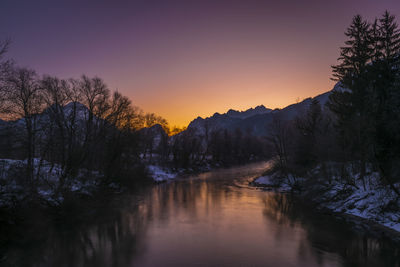 Scenic view of lake against sky during sunset