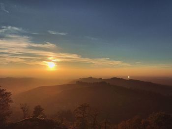 Scenic view of silhouette mountain against sky during sunset