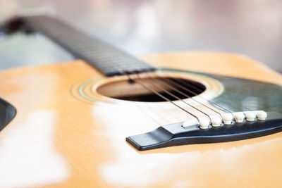 Close-up of guitar on table