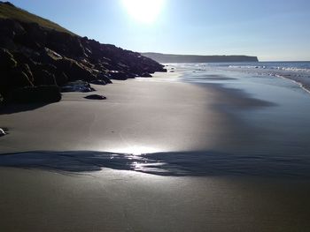 Scenic view of beach against clear sky