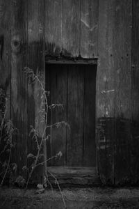 Old wooden door of abandoned building