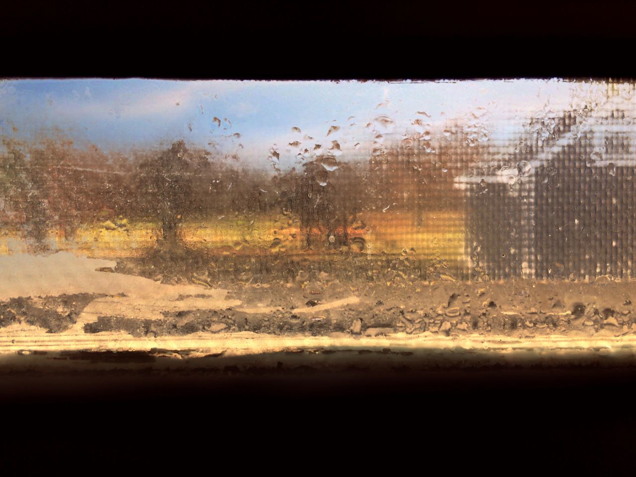 glass - material, window, transparent, wet, car, weather, mode of transport, transportation, drop, rain, water, vehicle interior, no people, sky, land vehicle, close-up, sunset, full frame, nature, day, raindrop, airplane, rainy season, indoors, tree