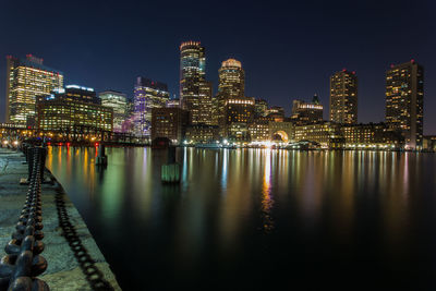 Illuminated city at waterfront