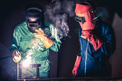 Mechanics welding in workshop
