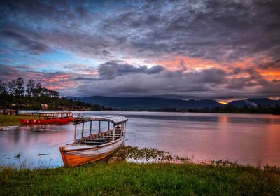 Scenic view of lake against sky during sunset