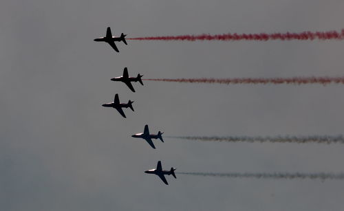 Low angle view of airplane flying in sky