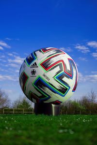 Low angle view of basketball ball on field against sky