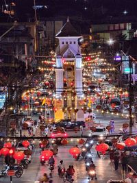 High angle view of people on street at night