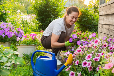Side view of woman gardening