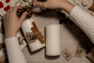 Cropped hand of woman holding gift