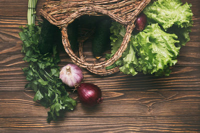 High angle view of vegetables in basket on table