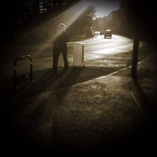 night, walking, street, shadow, full length, lifestyles, illuminated, sunlight, standing, men, leisure activity, rear view, low section, dark, unrecognizable person, silhouette, the way forward, road