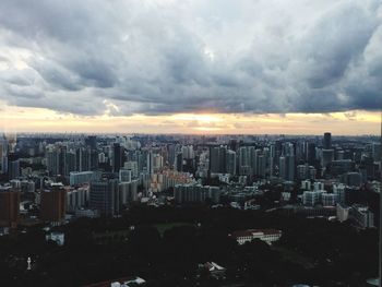 High angle view of city against cloudy sky