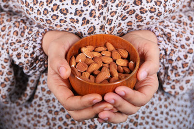 Midsection of woman holding ice cream