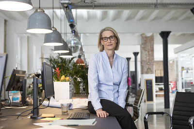 Mature business woman working in office