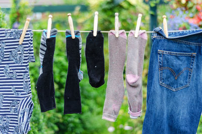 Clothes drying on clothesline against blurred background