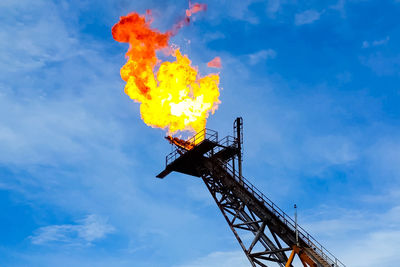 Low angle view of fire against sky