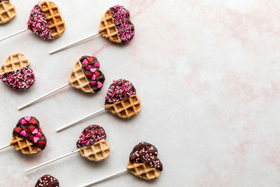 Valentine's day waffle pops laying flat with copy space to the right.