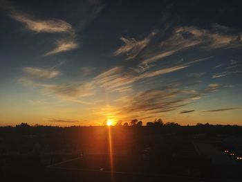 Silhouette trees against sky during sunset