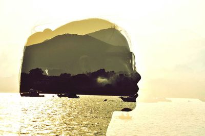 Silhouette of man on landscape against clear sky