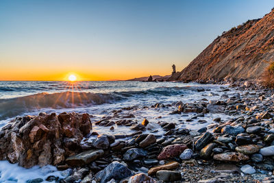 Scenic view of sea against sky during sunset