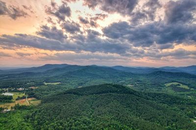 Aerial view of landscape against sky during sunset