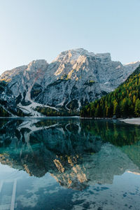 Scenic view of lake and mountains against clear sky