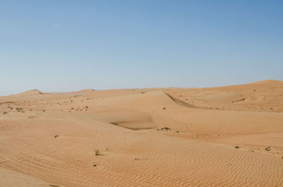 Scenic view of desert against clear sky