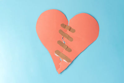 Close-up of heart shape against blue background