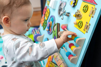 Close-up of boy playing with toy