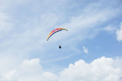 Low angle view of parachute against sky