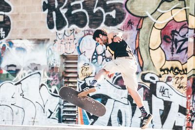 Close-up of graffiti on brick wall