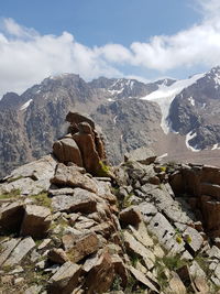 Rocks on mountain against sky