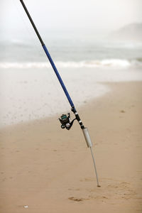 Close-up of water falling on beach