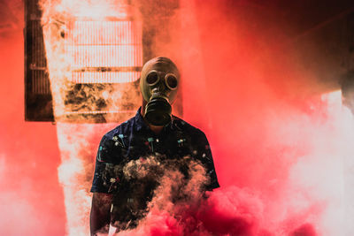 Midsection of man wearing mask against the sky