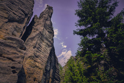 Low angle view of rock formation against sky