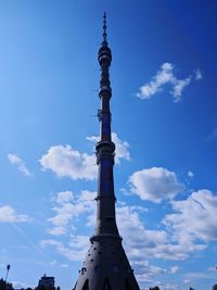 Low angle view of building against cloudy sky