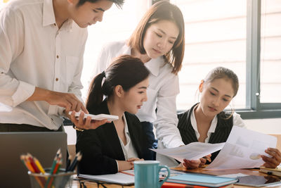 Business colleagues working at office