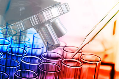 Digital composite image of scientific experiment over multicolored background