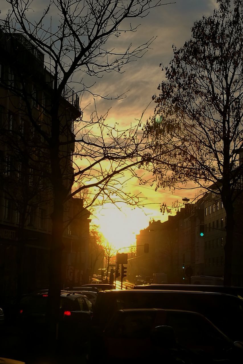 CARS ON ROAD AT SUNSET