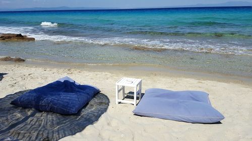 Scenic view of beach against blue sky