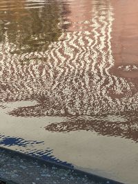 High angle view of wet sand on beach