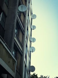 Low angle view of building against clear blue sky