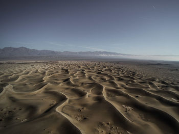 Scenic view of desert against clear sky