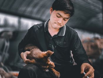 Man holding dog