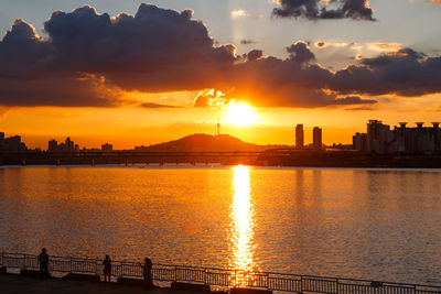 Scenic view of sunset over city